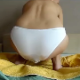 Sophie takes a shit in her white panties as we get to watch her growing bulge. Over a minute.